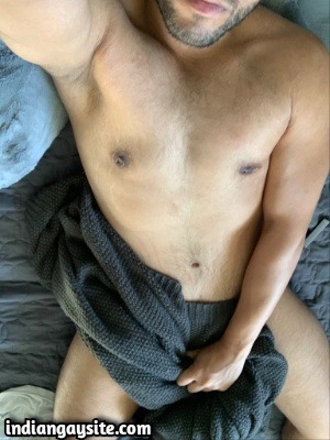 Naked Indian man exposing bare body and cock