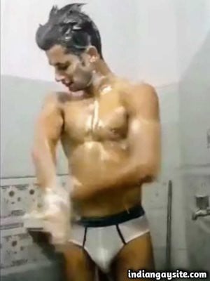 Naked teen boy taking bath in briefs in college
