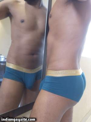 Muscular underwear hunk teasing body in briefs