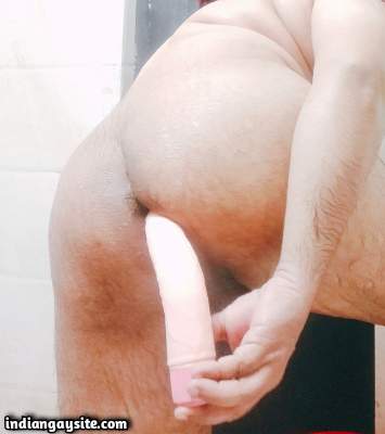 Nude bottom boy teasing his butt while riding dildo