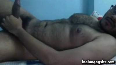 Hairy young man wanking his thick big cock