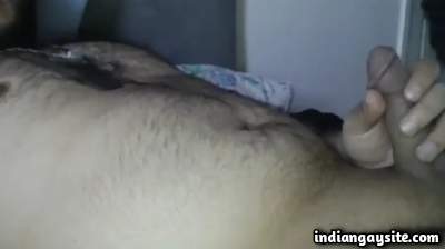 Naked horny bear plays with his big circumcised dick