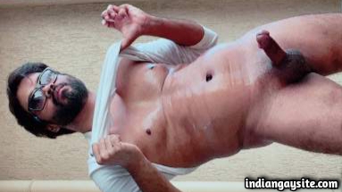 Hunky Indian man teasing big hard cock in nude pics