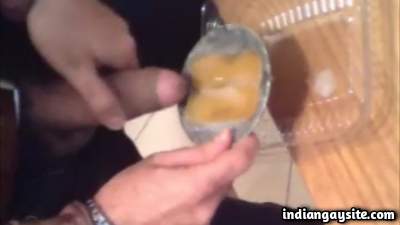 Cum eating man eating custard topped with own cumshot