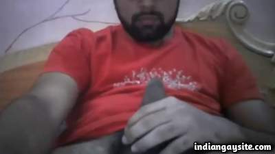 Masturbating young man teasing his big uncut boner