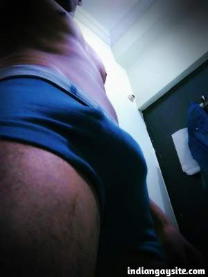 Big bulging man teasing his hard cock in sexy undies