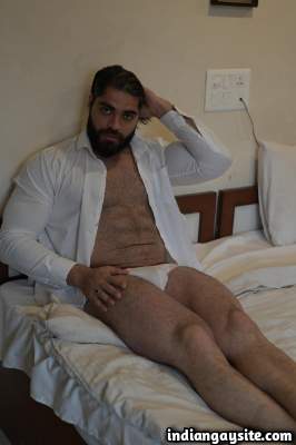 Hunky muscled man teasing his hairy fit body in pics