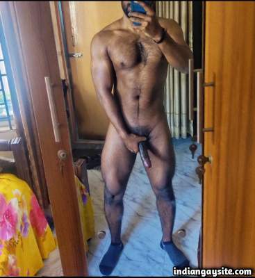 Muscular horny man teasing his huge dick in nudes