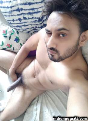 Hung sexy man teasing muscular body in gay porn pics