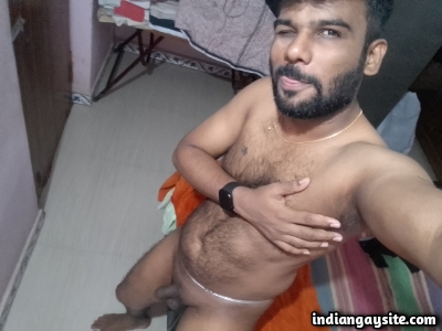Hairy nude man shows off sexy body and uncut cock