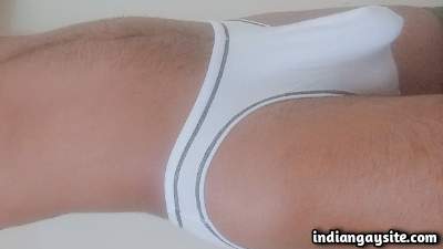 Horny underwear boy teasing his big cock in pics