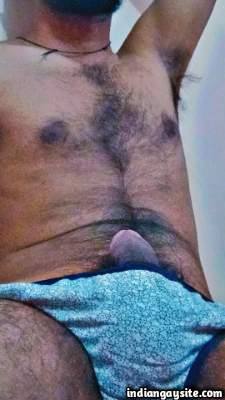 Hairy young guy teasing his sexy body in nude body pics